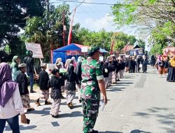 Babinsa Koramil Temayang Bojonegoro Bersinergi Kawal Pawai Karnaval Tingkat SD dan MI se- Kecamatan